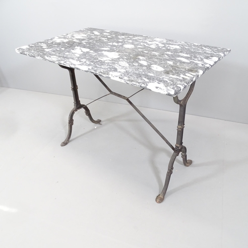 2088 - A veined black marble-topped garden table on cast iron stand. 100x70x60cm.