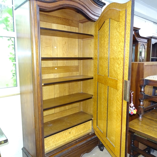 2091 - A French walnut arch top armoire, circa 1900, with single mirror door, maple panels, and shelved int... 