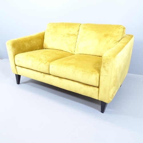 2097 - A contemporary upholstered two-seater sofa. Overall 144x83x95cm. Seat 115x48x55cm.