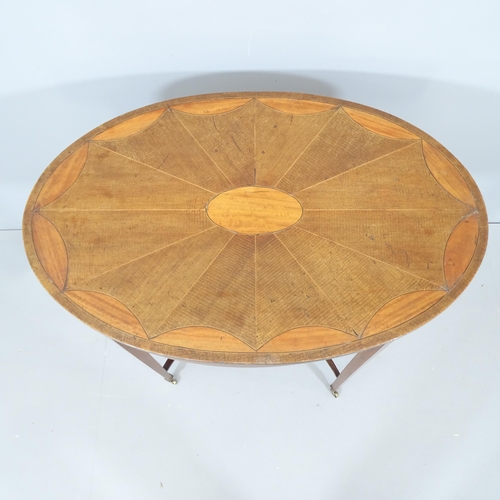 2098 - An Edwardian mahogany and satinwood strung oval occasional table, with scallop inlaid top and raised... 