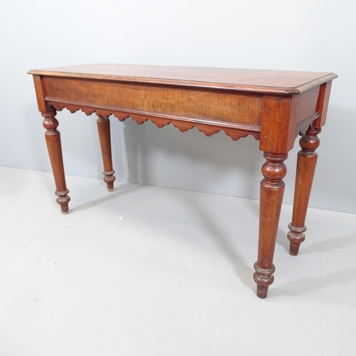 2100 - A Victorian mahogany console table, with end frieze drawer and raised on turned legs. 122x72x42cm.