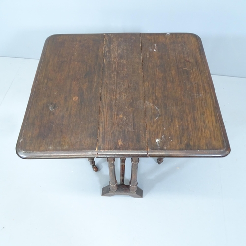 2110 - A small antique mahogany Sutherland drop-leaf table. 51x53x13cm.