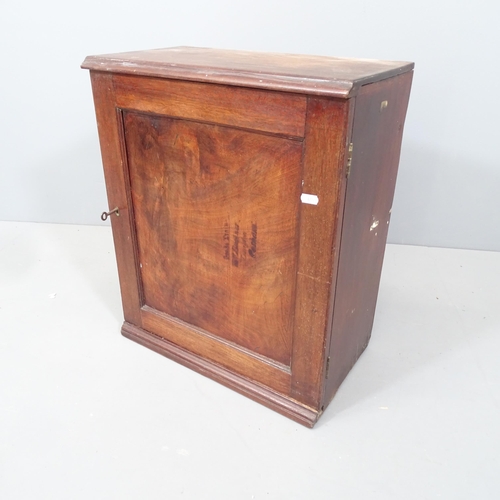 2111 - An Antique mahogany spice cupboard, the single door revealing a fitted interior. With key. 47x56x26c... 