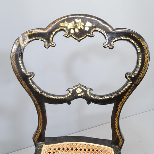 2112 - A Regency ebonised and gilded cane seated berger chair, with inlaid mother of pearl decoration.