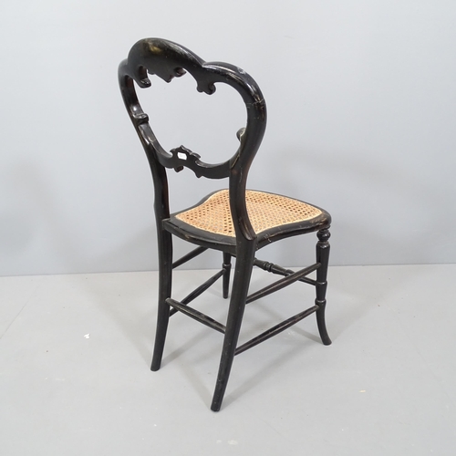 2112 - A Regency ebonised and gilded cane seated berger chair, with inlaid mother of pearl decoration.