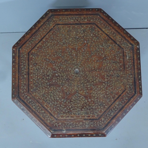 2114 - An Anglo-Indian octagonal occasional table on folding base, with inlaid brass leaf decoration. 46x46... 