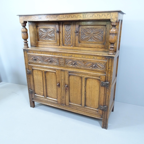 2123 - An early 20th century Ipswich Oak design court cupboard. 128x136x49cm. With key.