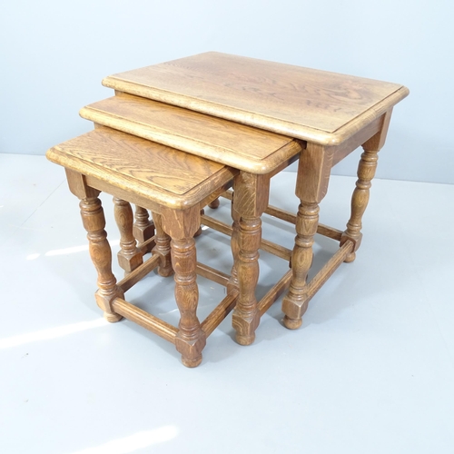 2125 - An Ipswich Oak design nest of three occasional tables. Largest 60x51x43cm.