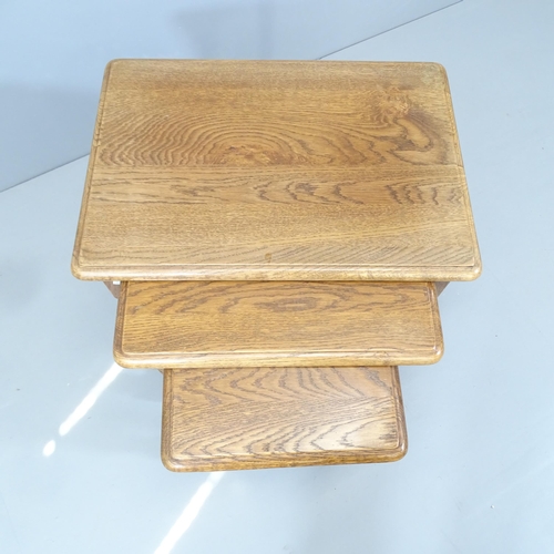 2125 - An Ipswich Oak design nest of three occasional tables. Largest 60x51x43cm.