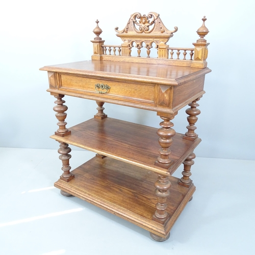 2127 - A Victorian oak three tier buffet, with raised gallery and single frieze drawer. 92x128x54cm.