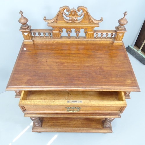 2127 - A Victorian oak three tier buffet, with raised gallery and single frieze drawer. 92x128x54cm.