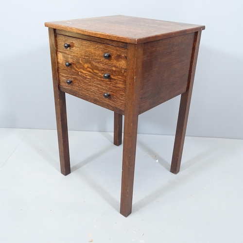 2135 - An antique oak sewing table with three fitted drawers. 43x69x43cm.