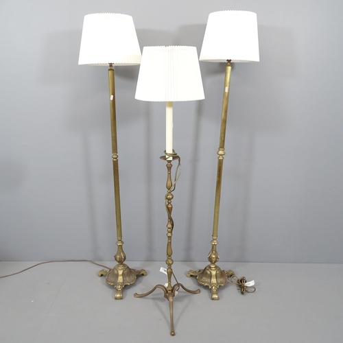 2139 - A pair of 1920s brass standard lamps, height to bayonet fitting 138cm, and another (3).