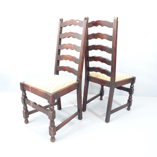 2142 - A set of six antique oak ladderback dining chairs with drop-in seats.