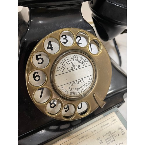 535 - A 1930s' GPO bakelite dial telephone, with number tray in base