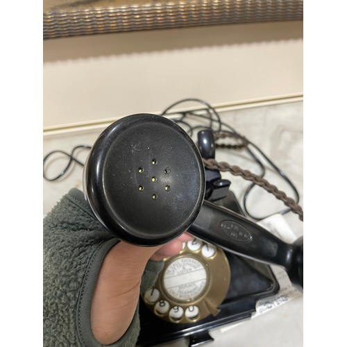 535 - A 1930s' GPO bakelite dial telephone, with number tray in base