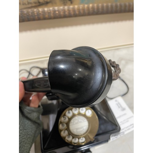 535 - A 1930s' GPO bakelite dial telephone, with number tray in base