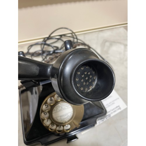 535 - A 1930s' GPO bakelite dial telephone, with number tray in base