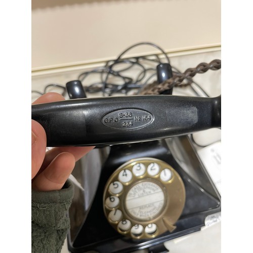 535 - A 1930s' GPO bakelite dial telephone, with number tray in base