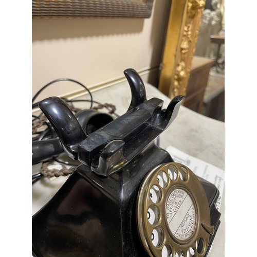 535 - A 1930s' GPO bakelite dial telephone, with number tray in base