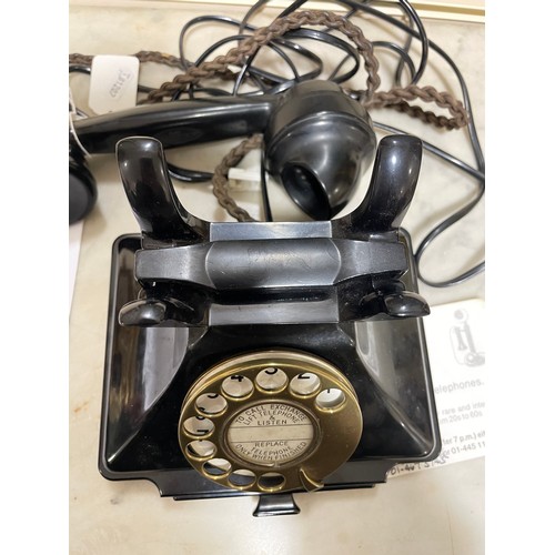 535 - A 1930s' GPO bakelite dial telephone, with number tray in base