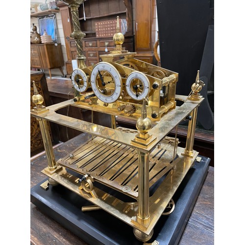 266 - A 20th century brass Congreve clock, with rolling ball fusee movement housed in glass display cabine... 