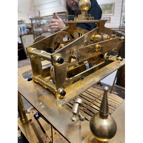 266 - A 20th century brass Congreve clock, with rolling ball fusee movement housed in glass display cabine... 