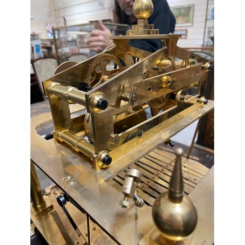 266 - A 20th century brass Congreve clock, with rolling ball fusee movement housed in glass display cabine... 