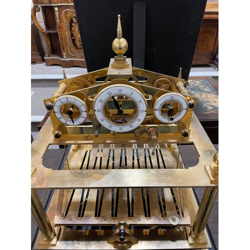 266 - A 20th century brass Congreve clock, with rolling ball fusee movement housed in glass display cabine... 