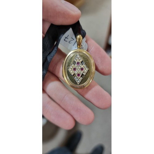 1127 - A Victorian ruby and pearl photo locket pendant, circa 1880, unmarked yellow metal settings with app... 