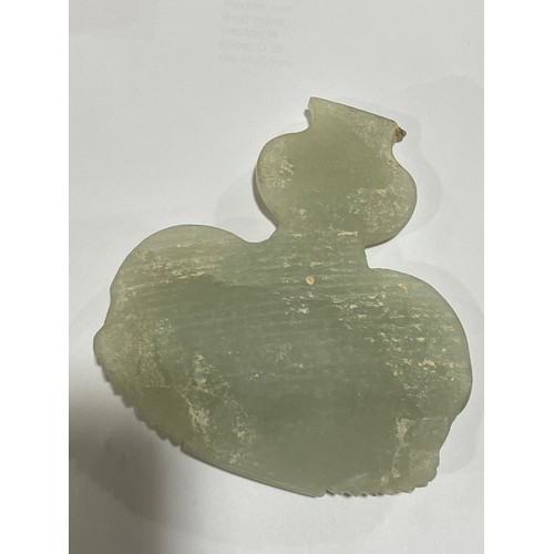 56 - A Chinese carved jade elephant amulet, and a lavender jade furniture mount, width 9cm (2)