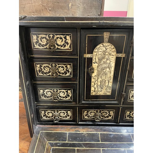 264 - An 18th century Italian ebonised table-top cabinet with ivory engraved panels of Classical form, wit... 