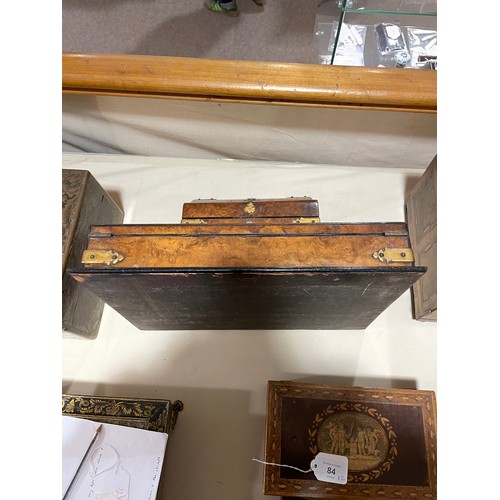 10 - A Victorian burr-walnut desk stand, with hinged stationery compartment above, and gilt-brass strapwo... 