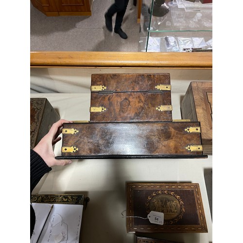 10 - A Victorian burr-walnut desk stand, with hinged stationery compartment above, and gilt-brass strapwo... 