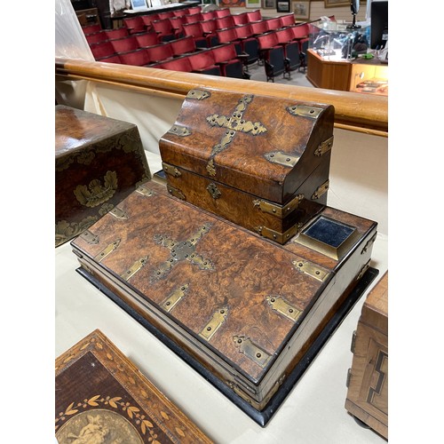 10 - A Victorian burr-walnut desk stand, with hinged stationery compartment above, and gilt-brass strapwo... 