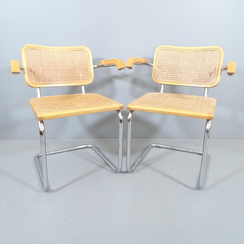 2019 - A pair of similar mid-century design cantilever armchairs with cane panelled back and seat, in the m... 