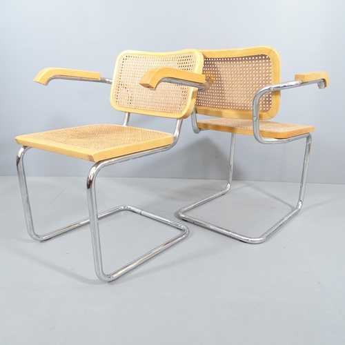 2019 - A pair of similar mid-century design cantilever armchairs with cane panelled back and seat, in the m... 