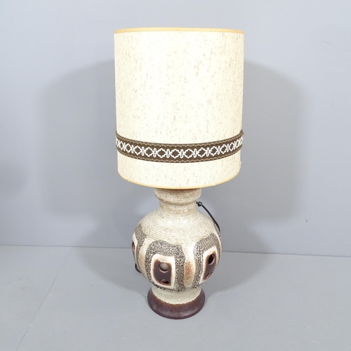 2024 - A mid-century West German pottery lamp with original shade. Height overall 84cm.