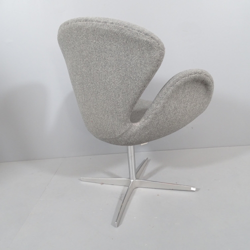 2035 - A mid-century style swivel lounge chair in the manner of the Arne Jacobsen Swan chair.