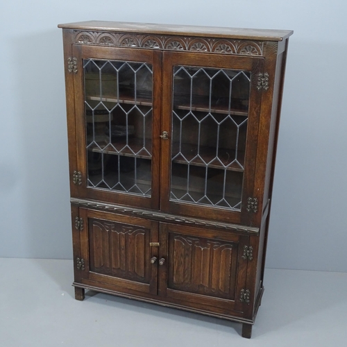 2144 - A Jaycee oak linenfold and leadlight glazed 2-door bookcase. 95x136x33cm. With key.