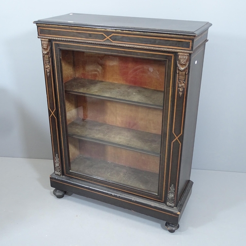 2146 - A Victorian ebonised pier cabinet, with single glazed door, satinwood banding and ormolu mounts. 79x... 