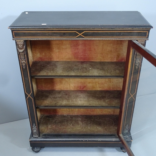 2146 - A Victorian ebonised pier cabinet, with single glazed door, satinwood banding and ormolu mounts. 79x... 