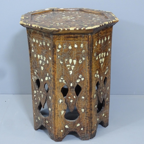 2149 - An Anglo-Indian octagonal occasional table with inlaid bone and mother-of-pearl decoration. 40x50cm.