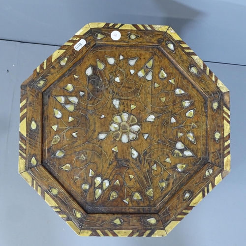 2149 - An Anglo-Indian octagonal occasional table with inlaid bone and mother-of-pearl decoration. 40x50cm.