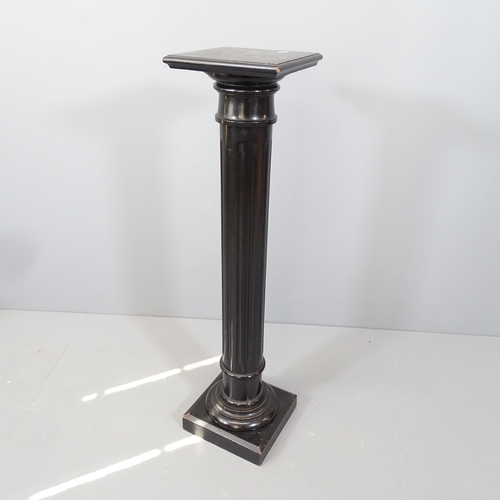 2156 - An ebonised column pedestal. 26x111cm