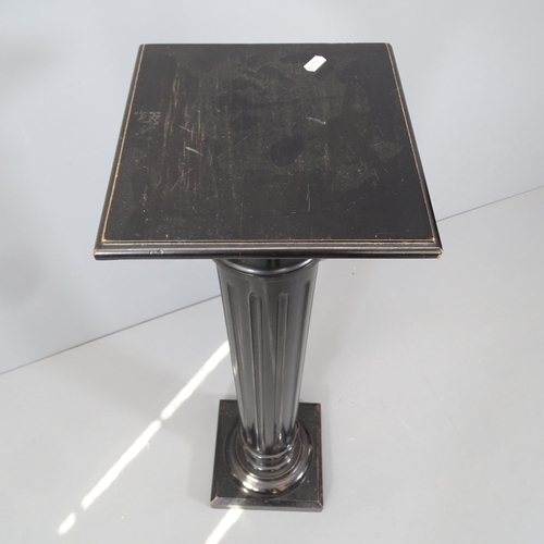 2156 - An ebonised column pedestal. 26x111cm