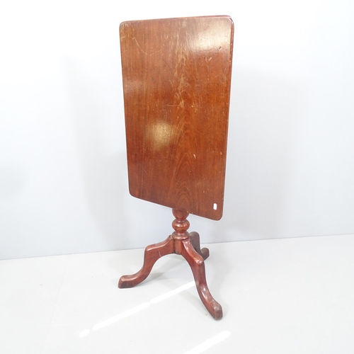 2160 - An antique mahogany rectangular tilt-top occasional table on tripod base. 74x73x46cm. When folded he... 