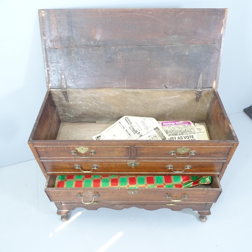 2162 - An antique oak two-section chest on stand, with lifting lid, two dummy drawer fronts and two drawers... 