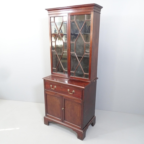 2164 - A 19th century mahogany two-section bookcase on cabinet. 66x165x43cm.