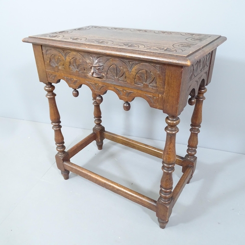 2178 - An antique carved oak side table, on turned legs with all around stretcher and carved green man deco... 